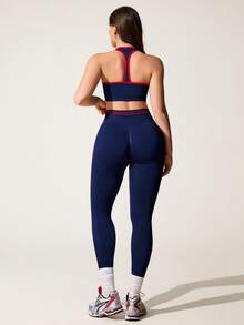 Core Rhythm Bộ đồ thể thao không đường may màu xanh hải quân dành cho nữ, gồm áo tank top ngắn cổ yếm và quần legging. - Màu xanh hải quân - Xem 6