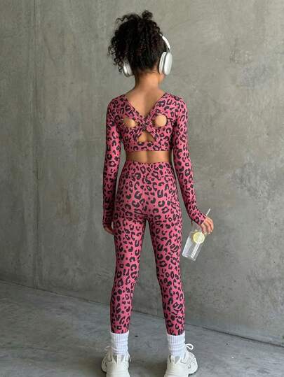 SHEIN 少女黑色长袖运动套装，采用紧身高弹面料，背部交叉镂空设计，适合健身、骑行、慢跑、运动等场合。