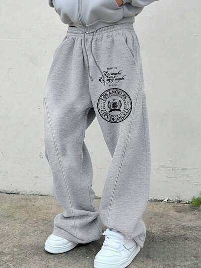 Manfinity EMRG Men's Grey Heather Los Angeles City Of Angels Badge Print Sweatpants | Summer Streetwear LA Rich City Crown Emblem Graphic Joggers | Y2K Vintage West Coast California EST 1989 Drawstring Elastic Waist Long Pants | Urban Hip Hop American Pride Loose Fit Wide Leg Trousers Holiday Vacation Wear | Soft Breathable Comfortable Daily Outdoor Sports Activewear,Men's Slogan Print Drawstring Waist Pocket Loose Fit Casual Sweatpants Grey Baggy Sweatpants Men Grey Sweatpants