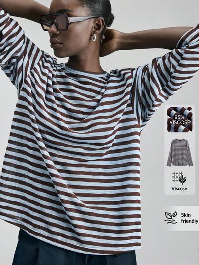 Ontre Damblus i tvåfärgat beige och blått, mjukt och bekvämt tyg, lös passform, nedsänkta axlar, långärmad, avslappnad blus, mångsidig, modern urban chic, affärsmässig casual, kontorskläder, diskret elegant, högkvalitativ designer, minimalistisk och bekväm, urban serietopp