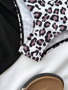 这款少女连体泳衣采用可爱的豹纹印花，配有肩带、荷叶边和裙摆，适合夏季游泳、度假和海滩穿着，是少女夏季假期的理想泳装套装。 - 彩色 - 查看 4