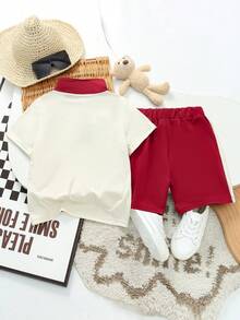 SHEIN Explorewe 2 pièces/set Jeune garçon Décontracté Sports Collège Chic Mignon Cool T-shirt à motif W + Short, Convient pour le port quotidien, l'école, les sorties, les sports, le printemps/l'été. Offre de multiples options d'assortiment pour les jeunes garçons, augmentant la diversité des combinaisons vestimentaires. La conception d'ensemble est simple et généreuse, confortable et à la mode à porter. Les garçons portant cet ensemble de t-shirts se sentiront à l'aise et arboreront une image mode décontractée. Cet ensemble de tenues deviendra un choix pratique et élégant dans la garde-robe des jeunes garçons. - Multicolore - Voir 2