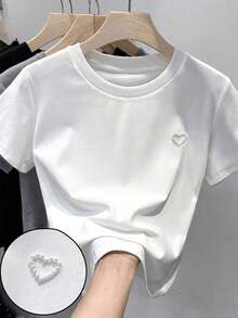 SHEIN Áo thun dệt kim màu trắng dáng rộng cổ tròn họa tiết trái tim đính hạt cườm thanh lịch đa năng thoải mái cho bé gái tuổi teen, thích hợp cho mùa xuân/hè. - trắng - Xem 1