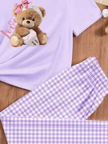 Bộ đồ mặc nhà tối giản phong cách thường ngày dành cho bé gái tuổi teen, gồm áo thun cổ tròn tay ngắn và quần ống rộng, họa tiết gấu dễ thương và kẻ caro, thích hợp cho mùa xuân/hè. - Nhiều màu - Xem 4
