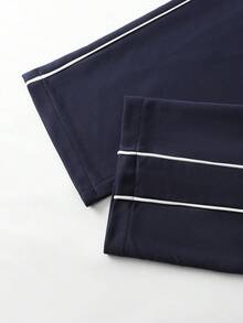 Manfinity Homme 男士落肩长袖拉链休闲夹克套装，男士运动服套装，男士运动套装，男士海军蓝套装，男士慢跑套装，适合复古风格、日常休闲、周末旅行、户外活动、探险旅行、轻松的工作环境或半正式场合，可作为男友/丈夫礼物、周年纪念/生日礼物，也适合派对、夏季、新年、婚礼、情人节等场合。 - 藏蓝色 - 查看 4