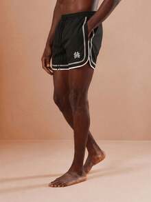 SUMWON Regular Curved Hem Beach Shorts With Contrast Trim And Logo Detail For Summer Swimming Vacation - Black - View 3