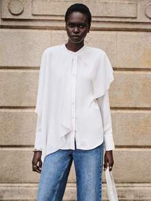 Lumivelle Blusa elegante, sexy y romántica para mujer, de estilo casual u oficina, con cuello de pie, asimétrica, con volantes exagerados en el bajo, cintura con lazo, de tela de gasa fluida y transparente de unicolor, nueva colección primavera/verano - Blanco - Ver 6