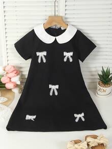 一件少女奢华学院风黑色娃娃领连衣裙，白色撞色领口+珍珠蝴蝶结装饰+钥匙孔镂空设计，A字廓形，适合周末郊游、派对、生日庆祝、返校等场合。 - 黑色 - 查看 1