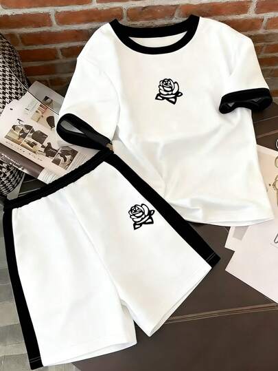 Resyla 新款休闲街头风黑色条纹印花圆领短袖上衣和短裤两件套，夏季必备。是热门节日礼物、姐妹礼物、休闲穿着和馈赠的理想之选。简约时尚的上衣和短裤套装。