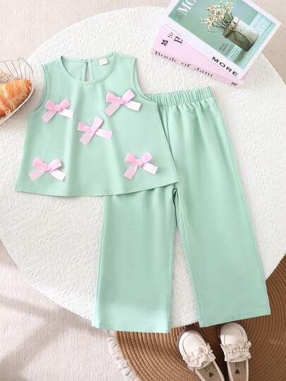 Souflis Souflis Set de 2 piezas de top sin mangas con decoración de moño 3D y pantalones cortos para niñas pequeñas, de moda y lindos, versátil para uso diario, vacaciones, primavera/verano