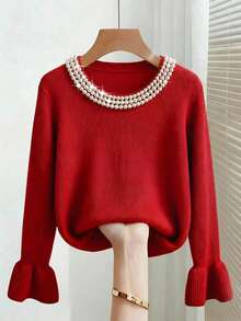Franclia 这款优雅百搭的红色针织衫散发着浓郁的节日气息。它采用圆领设计，宽松版型，罗纹袖口呈喇叭状，领口处饰有多层珍珠。这款宽松的红色毛衣适合情人节、派对、周年纪念日以及日常穿着，是秋冬季节的理想之选。它优雅时尚，是节日派对、情人节和春季的完美之选。也适合作为女士优雅上衣和派对服饰。 - 紅色 - 查看 1