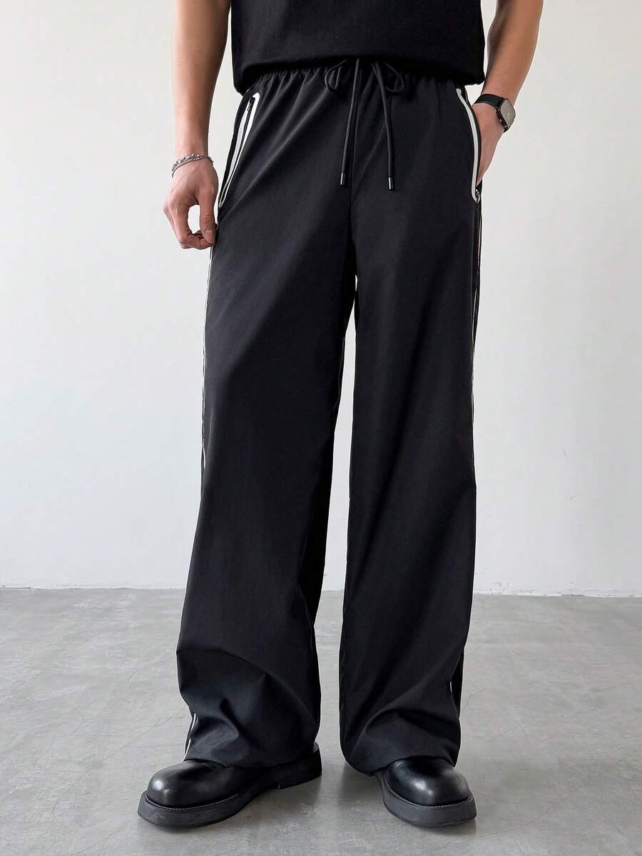 Manfinity Hypemode Quần nam ống rộng dáng suông, có dây rút ở eo và túi khóa kéo. - màu đen - Xem 1