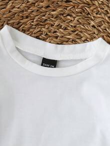 SHEIN Playful Pals Đầm denim dáng rộng thoải mái in hoa cho bé gái, màu be, tay ngắn, chất liệu cotton mềm mại nhẹ, là món đồ không thể thiếu cho các bé gái sành điệu, phù hợp mặc vào mùa xuân/hè, dạo phố, đi mua sắm, dã ngoại, mẫu mới mùa thu 2023. - Nhiều màu - Xem 10