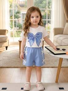 SHEIN Playful Pals Baby Girls' Cute Oversized Bow Print Short Sleeve Round Neck White Top Paired With Blue Shorts,Casual Minimalist Summer T-Shirt Set Vacation Outfits - White - View 3