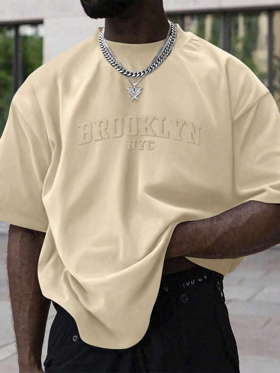 Manfinity Homme Áo thun ngắn tay nam cỡ lớn, phong cách thường ngày, in chữ, thích hợp cho việc đi làm hàng ngày. - Màu Khaki - Xem 1