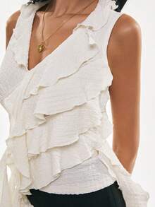 Poéselle Áo tank top nữ kiểu bất đối xứng xếp tầng, áo quấn dệt kim nhăn không tay, áo xếp tầng lãng mạn, áo bất đối xứng, áo nữ tính mùa hè, áo xếp tầng phong cách boho hẹn hò đêm, áo peplum lãng mạn, áo không tay màu trắng trơn phối viền xếp tầng thời trang đa năng, thích hợp cho hẹn hò và đi chơi, áo mùa xuân/hè, áo mùa hè cho nữ, áo ngày lễ tình nhân, áo lễ hội, áo kỳ nghỉ hè. - Màu be - Xem 3