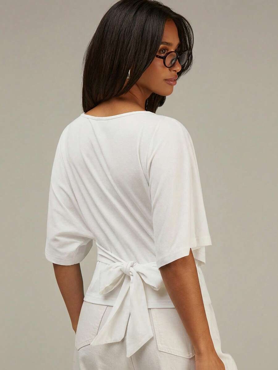 Athîral Blusa casual de mujer de unicolor con cuello redondo, mangas tipo murciélago y detalle de nudo en la espalda - Blanco - Ver 1