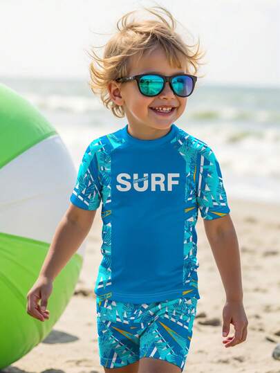 SHEIN Young Boy Casual Loose Fit Round Neck Short Sleeve T-Shirt And Shorts Swimwear Set, Suitable For Summer. Classic Cool Surfing & Skateboard Graphic Print, Surfing Text Print, Suitable For Beach Vacation, Swimming, Traveling.