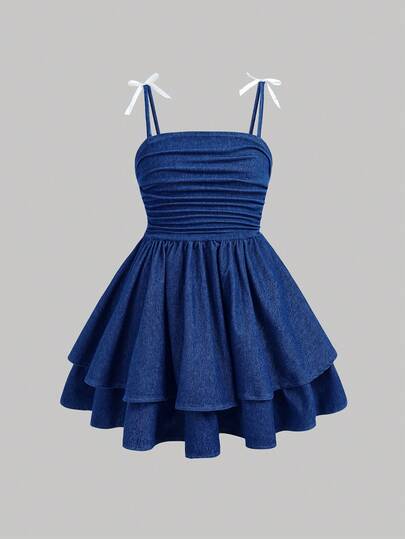 Girlism 这款少女时尚休闲 Y2K 复古酷炫街头风牛仔针织吊带裙，采用深蓝色面料，饰有蝴蝶结，弹性贴身设计，适合少女日常穿着，也适合春夏派对、节日和街头服饰穿着。全新 SS26 时尚单品