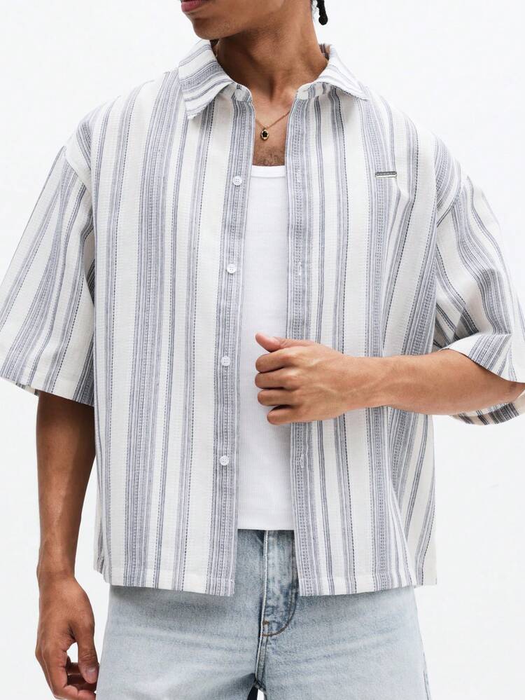 Camicia a righe a maniche corte con bottoni