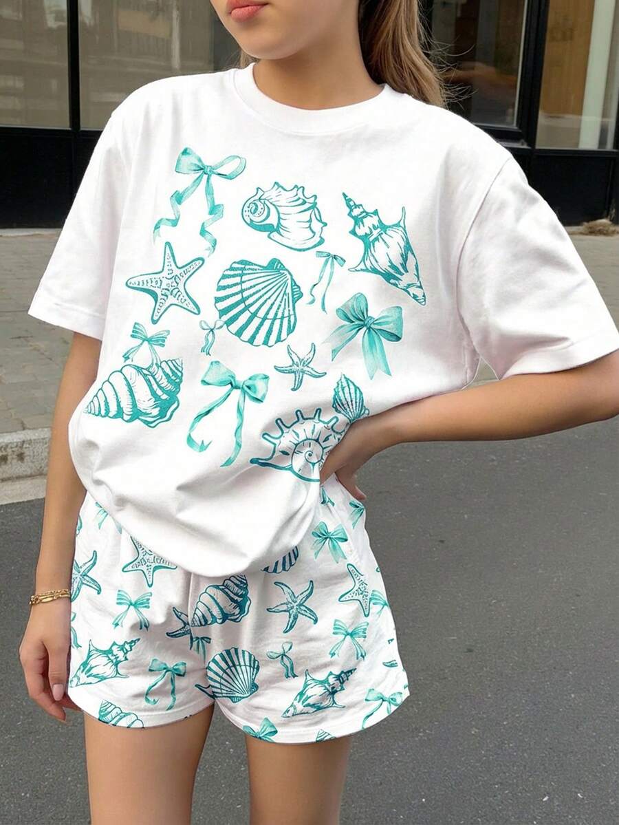 两件套可爱海洋生物、贝壳、蝴蝶结印花少女休闲短裤套装,适合夏季、夏日度假、休闲度假风,复古花卉、日落粉彩、轻松休闲。 - 彩色 - 查看 1