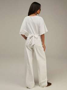 Athîral Blusa casual de mujer de unicolor con cuello redondo, mangas tipo murciélago y detalle de nudo en la espalda - Blanco - Ver 4