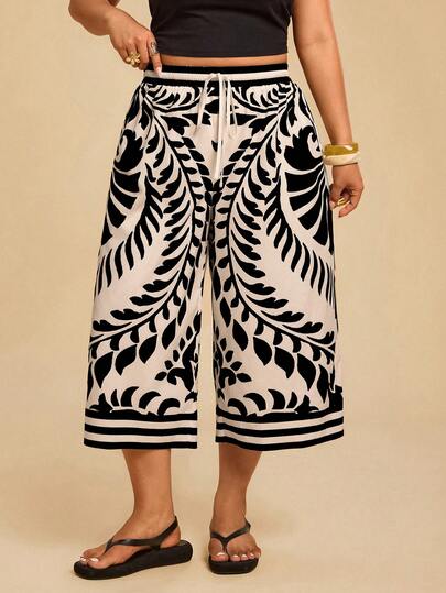 Travachic Pantalones capri de pierna ancha con estampado floral y cintura con lazo para mujer de talla grande
