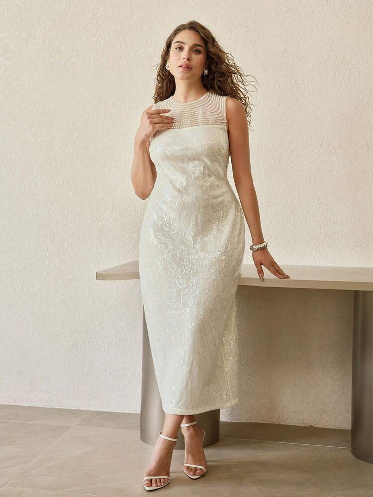 PLUS SIZE ELEGANT SLEEVELESS LONG-LENGTH SEQUIN PARTY DRESS – FAUX PEARL-EMBELLISHED GEOMETRIC ROUND NECK, FORM-FITTING SILHOUETTE WITH BACK ZIPPER & BACK SLIT DETAIL | IDEAL FOR NEW YEAR'S EVE, GALAS & FORMAL PARTIES | STYLE WITH STRAPPY HEELS & DELICATE JEWELRY