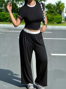 Muchica Bộ 2 món cỡ lớn gồm áo tay ngắn cổ tròn viền tương phản và quần cạp chun. - Đen và trắng - Xem 4