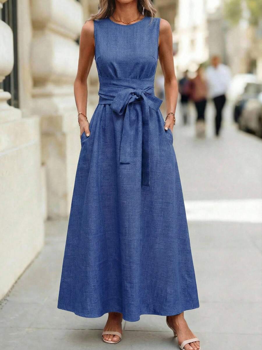 Editum Women's Sleeveless Round Neck Waist Cinched Textured Denim Blue Belted A-Line Elegant Everyday Casual Dress, Spring/Summer Spring Dress Women Features A Belted Waist, Pockets, Solid Blue Textured Fabric, And Is A Long Spring/Summer Dress. - Blue - View 1