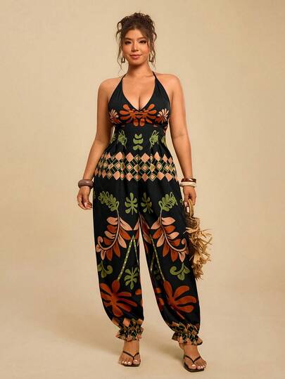 Travachic Mono de talla grande para mujer con estampado de plantas tropicales en negro, mono con tirantes finos, cuello en V y cintura con lazo, largo hasta el tobillo, mono casual para vacaciones en la isla