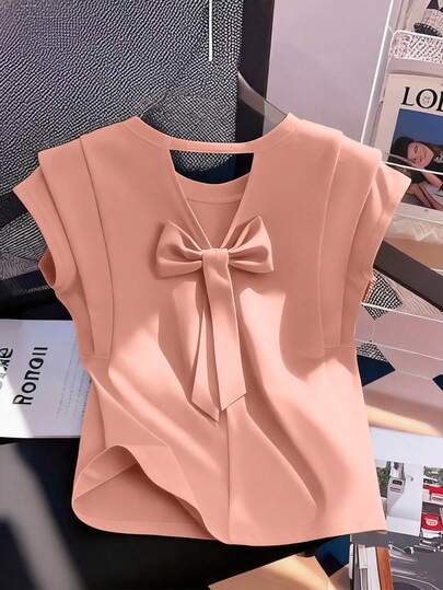 GlowEve Camiseta de moda de mujer de unicolor con cuello redondo, manga corta y decoración de lazo