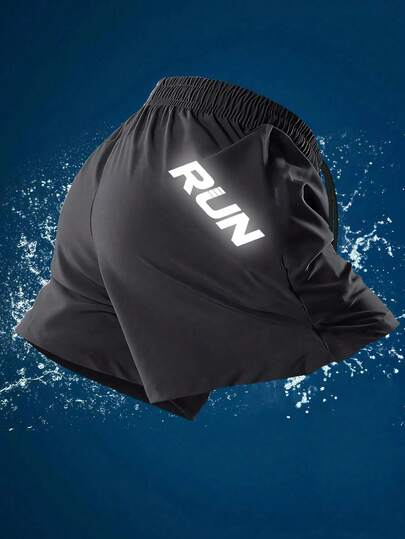 Manfinity Sport Corelite Pantalones cortos deportivos con cordón en la cintura y estampado de letras que brillan en la oscuridad para hombres