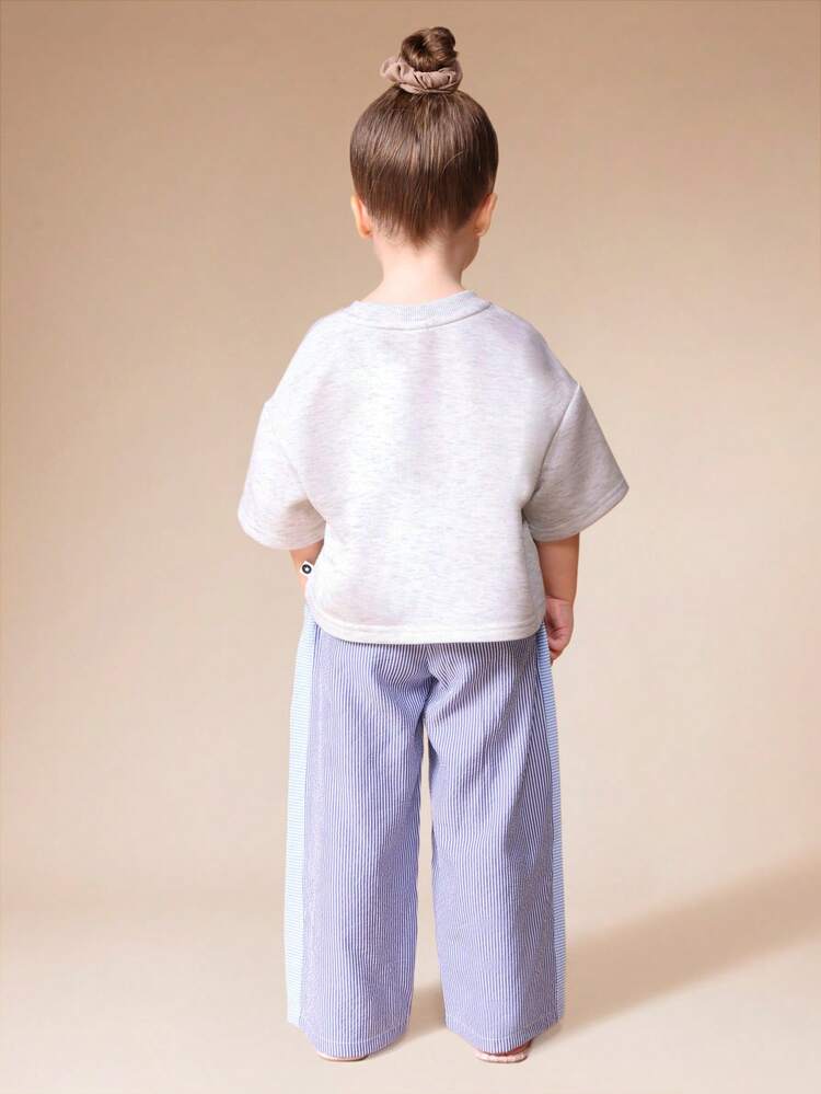 フレッシュフルーツプリントのオーバーサイズTシャツとストライプのワイドレッグパンツのセット