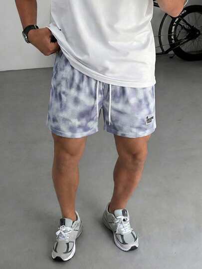 Manfinity EMRG 男士舒适网眼迷彩印花弹力腰抽绳短裤，热销运动品牌短裤，适合男士休闲、度假、日常约会、居家休闲、时尚派对、餐饮聚会等场合，自用或送礼皆宜。春夏热门短裤。