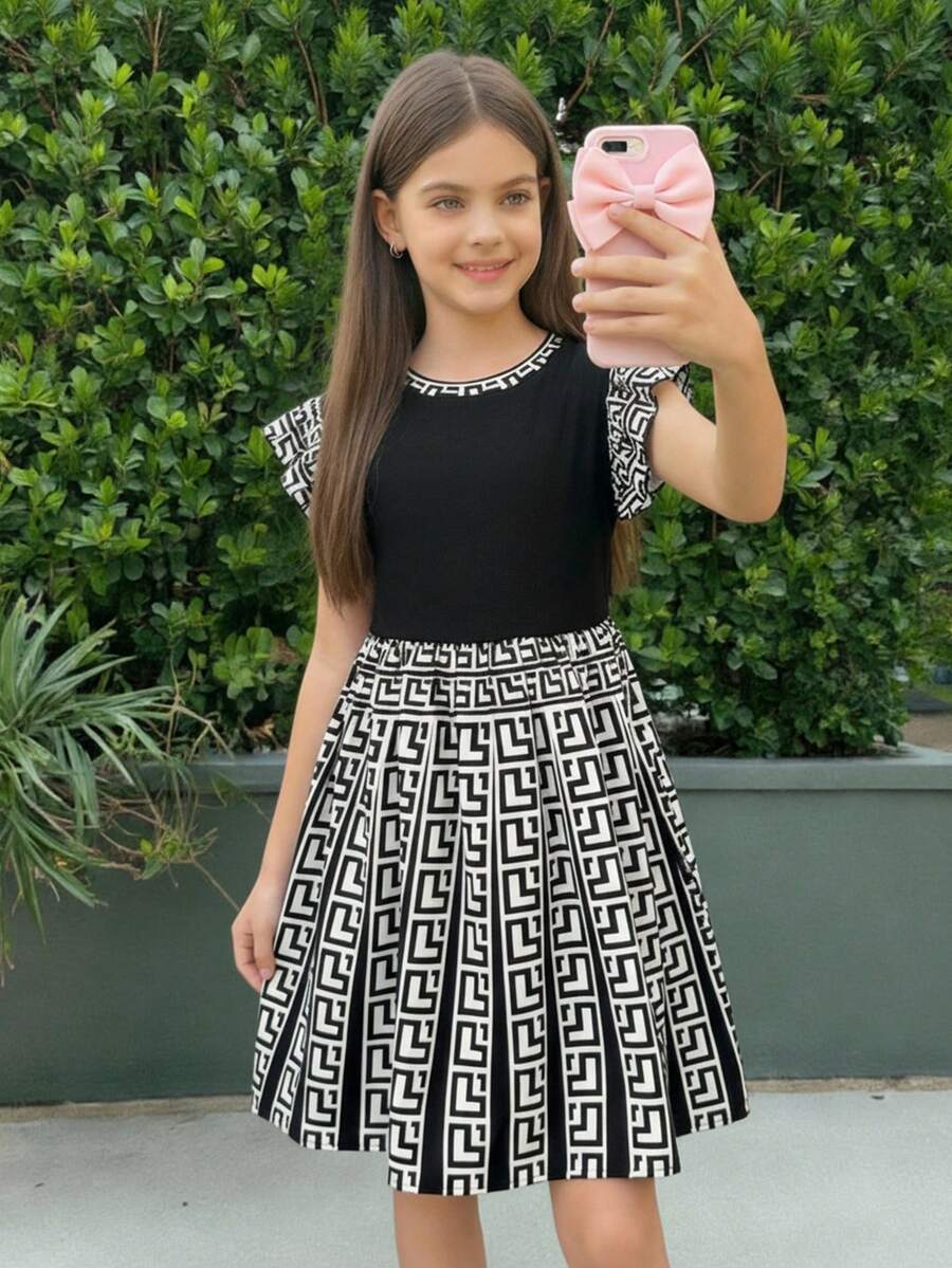 Firerie Kids Svart kontrasterande klänning med volangkant och stickad A-linjeform för flickor, åtsittande i midjan, prinsessmodell, avslappnad och trendig för vardagsbruk - Svart - Visa 1