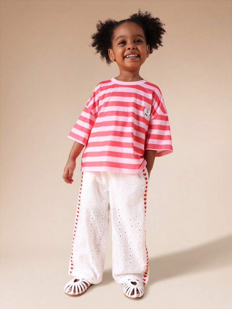 Ensemble t-shirt rayé et pantalon à œillets