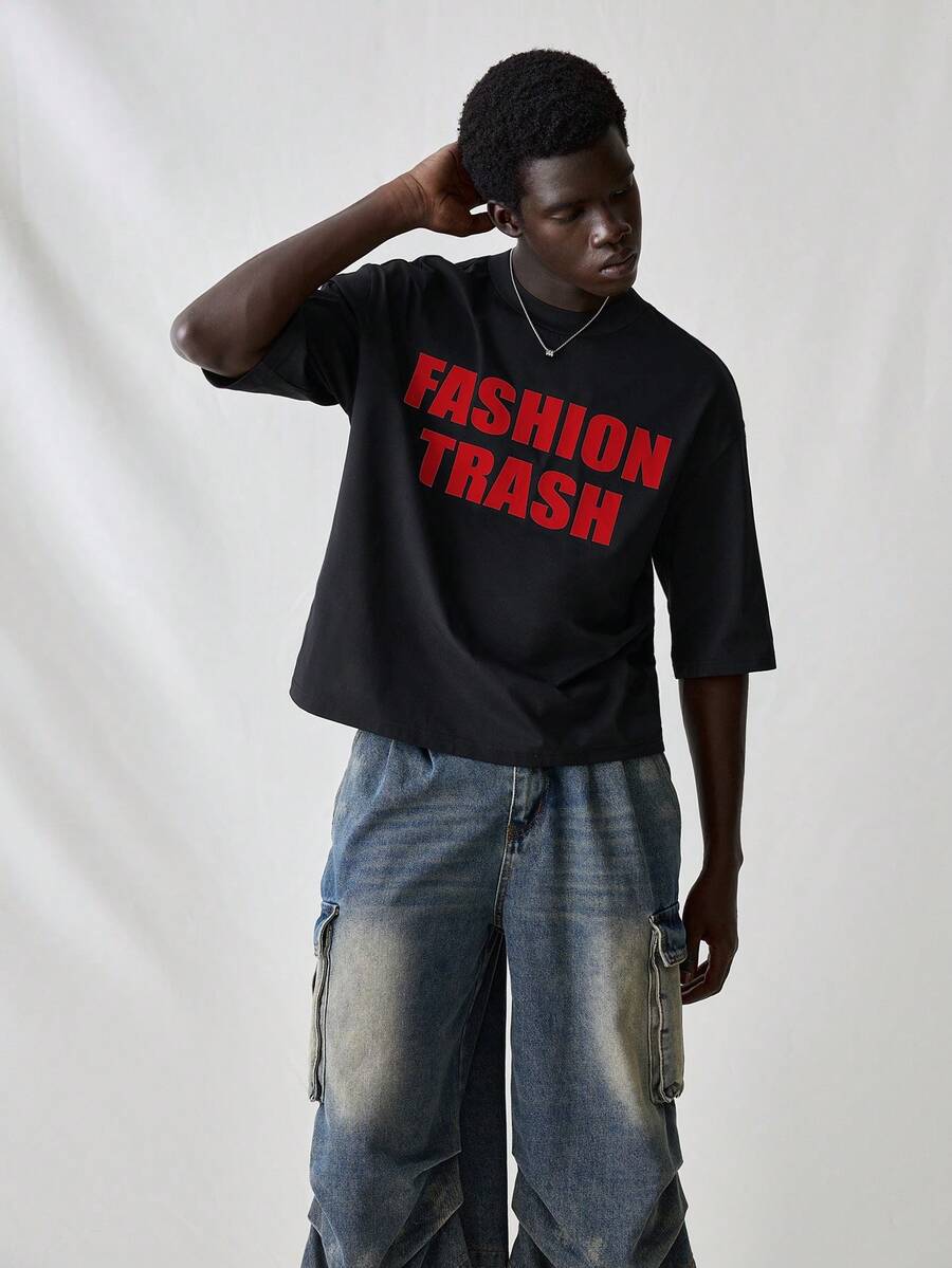 SWAVVY 男士针织休闲日常宽松短袖T恤，英文图案印花；男士短款印花衬衫；男士超大印花T恤；男士超大印花T恤；男士标语印花落肩T恤；男士短款T恤；男士超大短款印花T恤；男士短款印花衬衫 - 黑色 - 查看 1