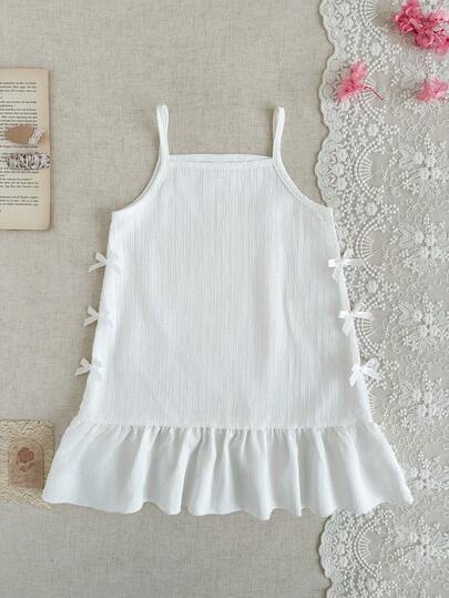 Young Girls White Textured Spaghetti Strap Dress, Pleated Soft Fabric, Ruffle Trim, Loose A-Line Silhouette, Bow Tie Accent, Sweet & Charming, Suitable For Summer Beach, Birthday Party, Princess