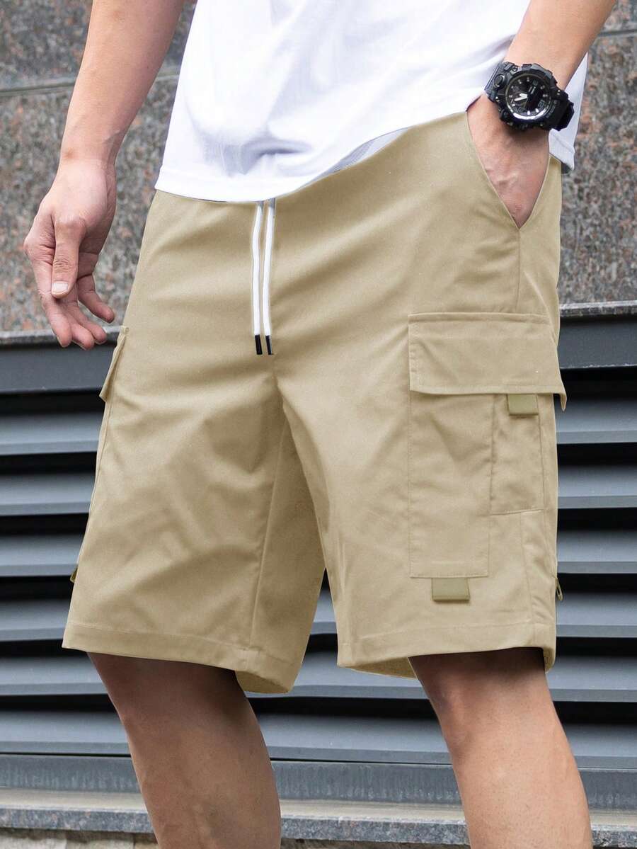 Manfinity Homme Quần short nam màu trơn có túi rút dây đa năng thường ngày - Màu Khaki - Xem 1