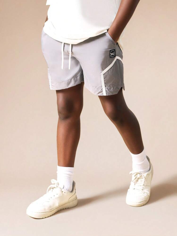 Pantaloncini in nylon con bordino bianco