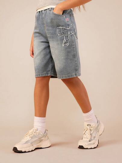 SUMWON Bleached Wash Bow Applique Mid Thigh Distressed Denim Shorts With Raw Hem Detail High Rise Wide Leg Jorts For Summer Casual Wear