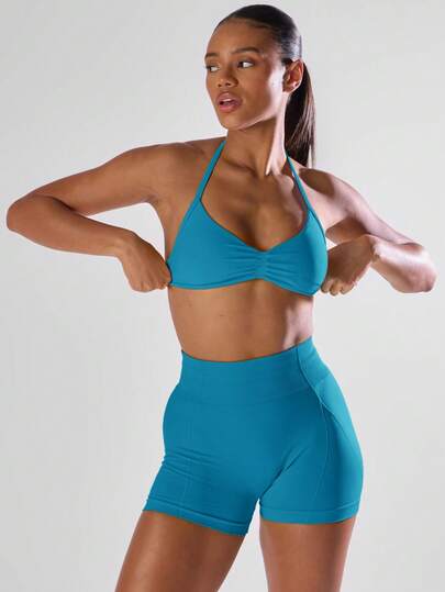 Musera Sport Sujetador deportivo con busto fruncido, espalda abierta y cuello halter, activo y cómodo para entrenamiento, gimnasio, correr, pádel, tenis, pickleball y fitness