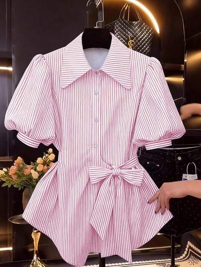 GlowEve Women's Blue And White Striped Fabric Shirt With A Turn-Down Collar, Button Placket, Cinched Waist, Bow Tie, And Flared Hem. The Design Exudes A Sophisticated And Elegant Charm, Suitable For Casual, Vacation, Preppy, Or Professional Settings. Perfect For Valentine's Day, Halloween, Spring, And Summer. A Must-Have Fashion Item For Spring And Summer, This Versatile Short-Sleeved Button-Down Shirt Features A Unique Design.