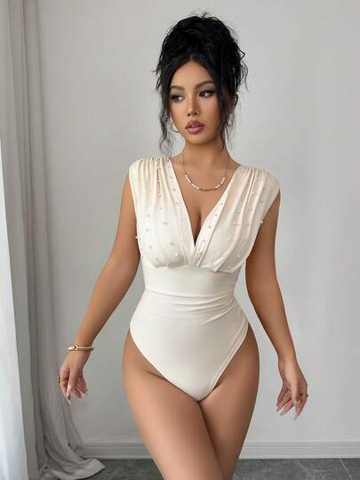 Selianne Body feminino elegante e romântico com pérolas artificiais na cor damasco