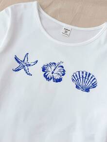 SHEIN Bộ 3 món cho bé gái tuổi teen, gồm áo thun ngắn tay cổ tròn in hình vỏ sò và sao biển + quần short/quần dài thắt nơ, kiểu dáng rộng rãi thoải mái. - Xanh và trắng - Xem 9