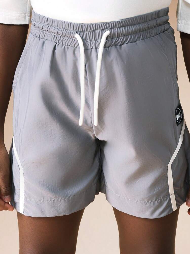 Pantaloncini in nylon con bordino bianco