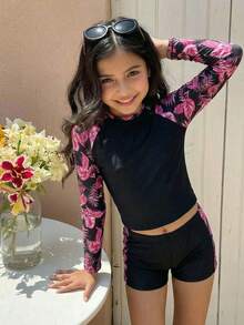SHEIN Conjunto de traje de baño con top de manga raglán y estampado de plantas tropicales, y shorts para niña preadolescente - Negro - Ver 2