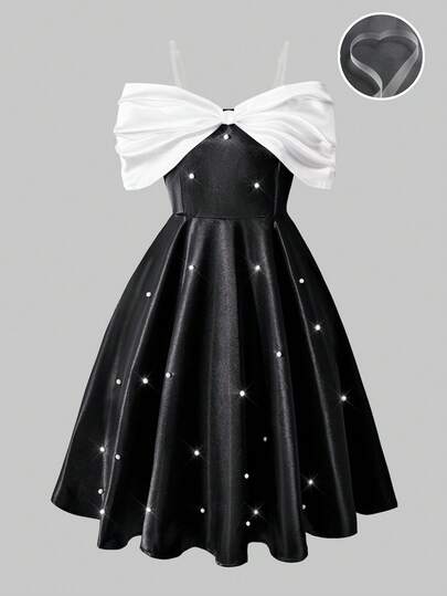 SHEIN 这是一款适合大龄女孩的黑白露肩A字连衣裙。它采用透明可拆卸可调节肩带，胸前饰有白色弹力编织面料的褶皱设计，正面点缀珍珠。这款时尚独特的连衣裙适合室内外穿着、参加派对以及日常穿着，紧跟潮流。是春夏的理想之选。