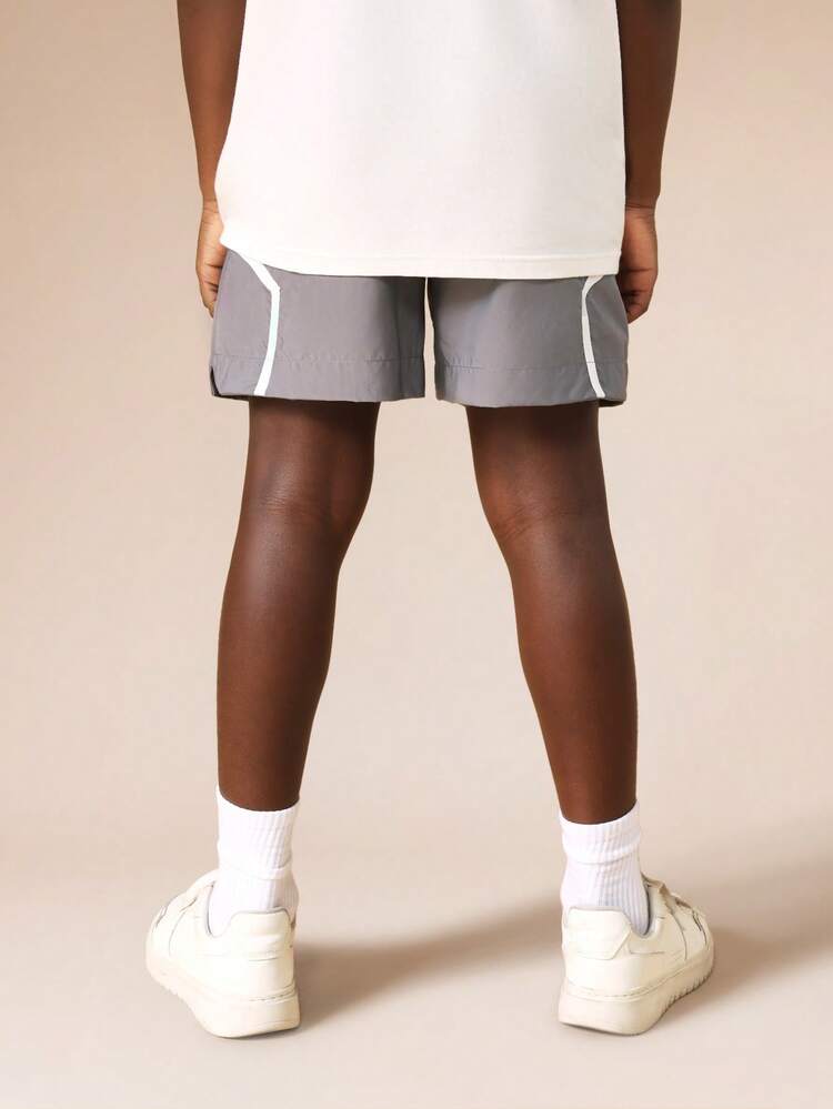 Pantaloncini in nylon con bordino bianco